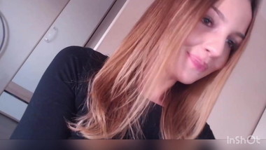 Jenny sucks a lollipop.