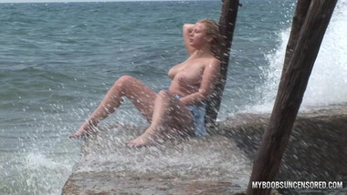 Busty teen Malina get wetting in waves