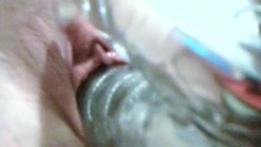 Close-up fucking herself with a rabbit vibrator