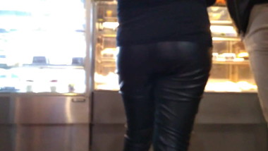 Girl in leather pants at the mall