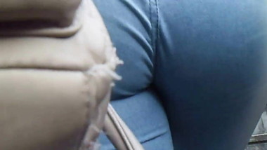 Girl with blue denim shorts eating rag