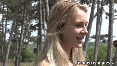 Cute lady gets closer to nature by masturbating in the woods