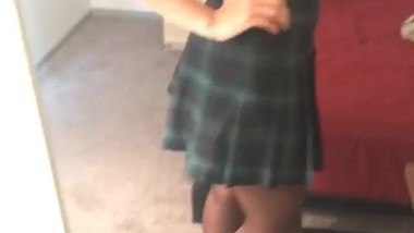 Amateur trying on pantyhose in the mirror