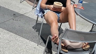 Carefree  blonde  airing out  her bare  soles