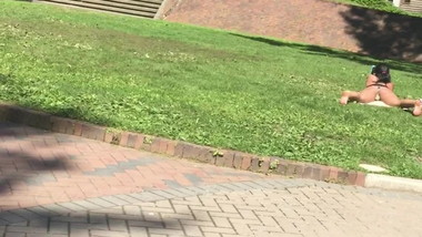 Hot college babe sunbathing